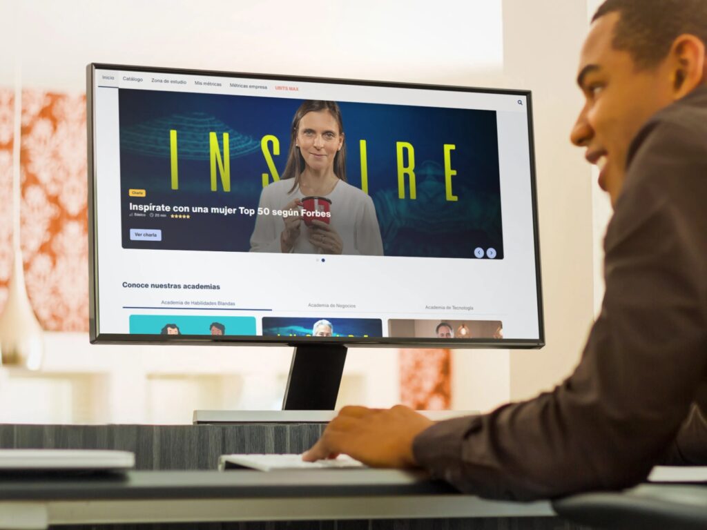 A student watches a video from an e-learning course on a desktop computer