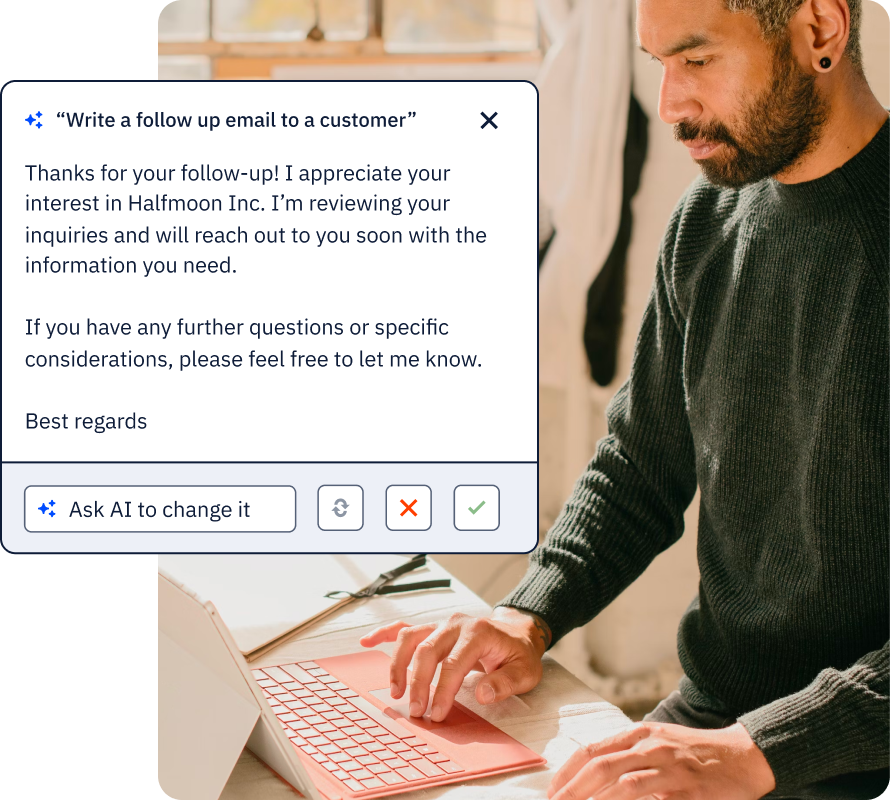 Man at laptop using AI to generate a followup email to customer